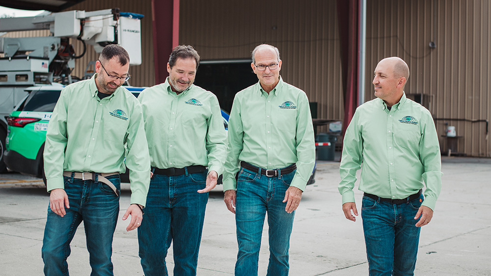 Employees walk together towards the camera.