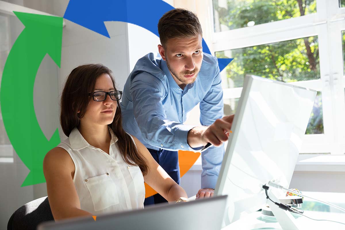 Work colleagues using the same computer with the Conexon icon behind them.